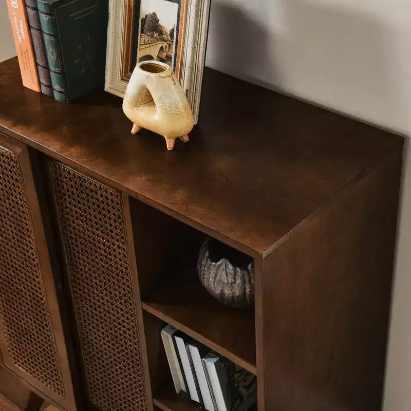 Medieval-inspired modern rattan sideboard with adjustable shelves and solid wood base, ideal for entryways or kitchens. Available in dark wood