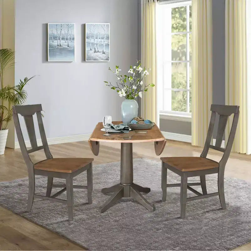 Tavolo da pranzo rotondo con 2 ante a ribalta da 42" con 2 sedie con schienale a pannello in Hickory/Antracite lavato - International Concepts