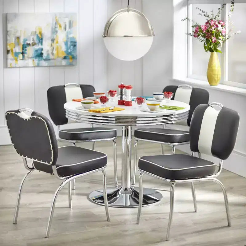 Set da pranzo Buylateral Raleigh retrò 5 pezzi, base a piedistallo cromata, sedie in similpelle