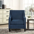 Poltrona d'accento Erica con borchie decorative cromate